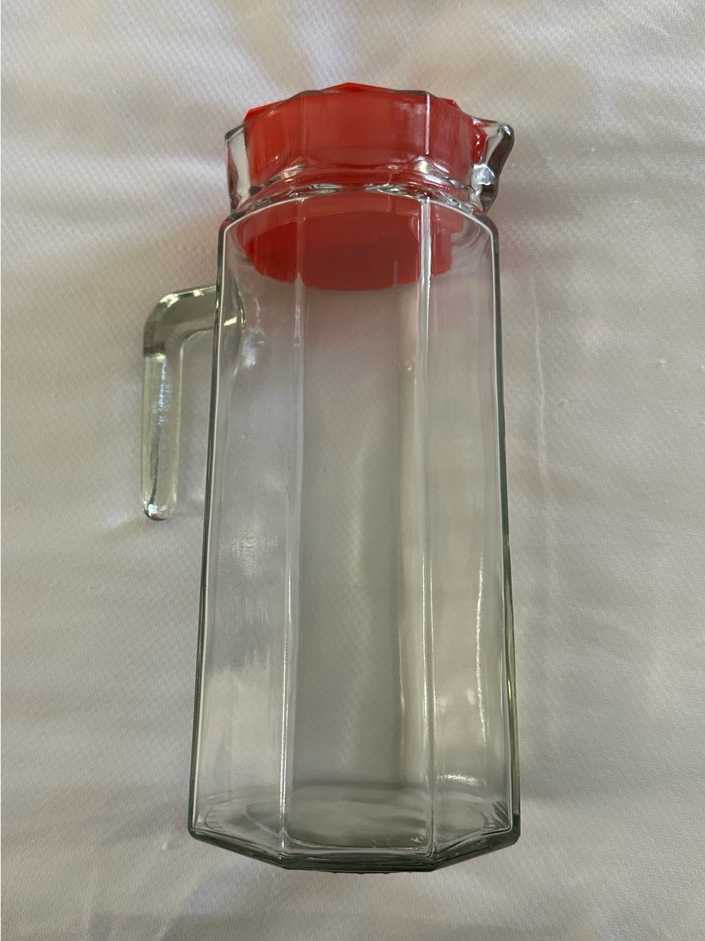 Glass pitcher with red lid • heavy
